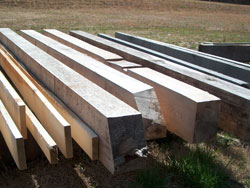Pine, red and white oak beams stacked for air-drying.